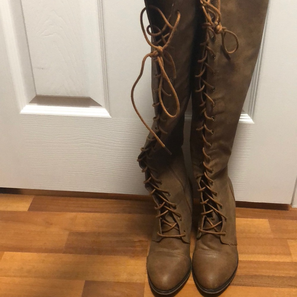 Worn one time. Lace up cognac knee high boots.